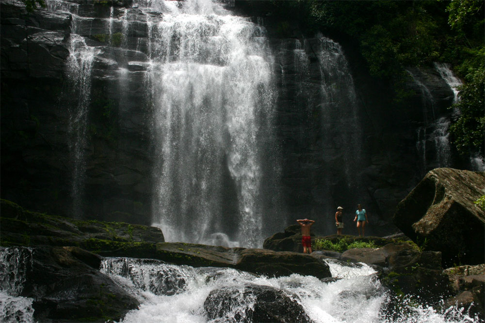 Visitors dwarfed at the foot of the Falls