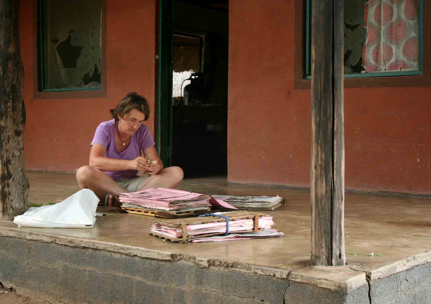 Petra Ballings pressing plants outside our hut at the Shashe Wilderness Camp, Tuli.